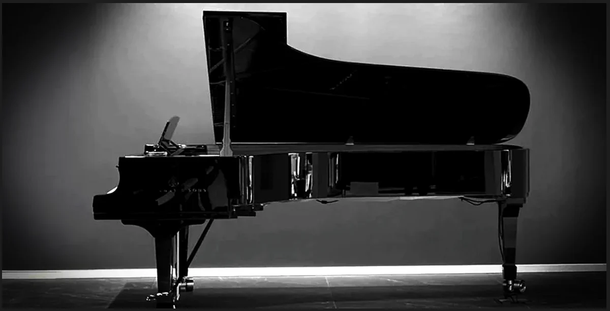 Black and white grand piano with sheet music